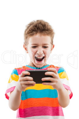 Smiling child boy playing games or surfing internet on smartphon