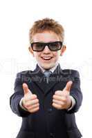 Smiling child boy in business suit wearing sunglasses gesturing