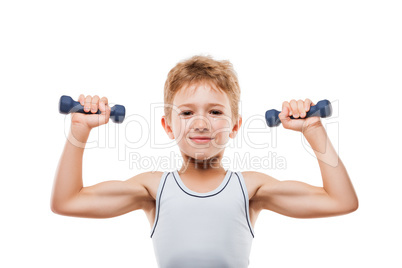 Smiling sport child boy with strong biceps muscles holding exerc