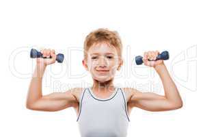 Smiling sport child boy with strong biceps muscles holding exerc