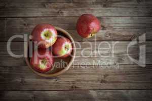 apples in a wooden saucer