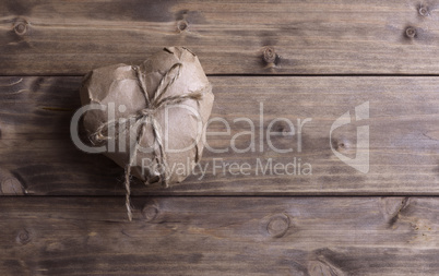 Heart wrapped in brown kraft paper