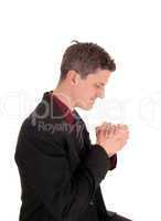 Praying businessman.