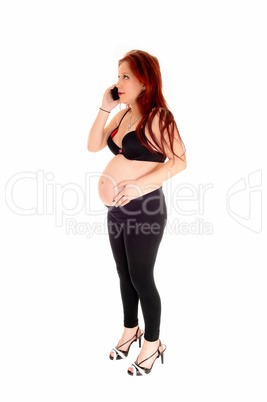 Pregnant woman on cell phone.