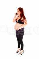 Pregnant woman on cell phone.