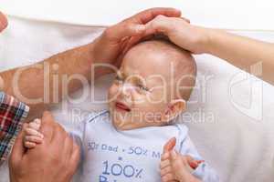 Parents calm a crying baby