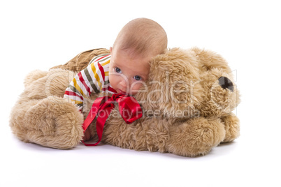 Baby boy over plush dog on white