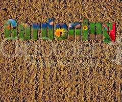 Colorful gardening text on soil and grass background