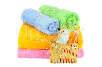 towels and shampoo isolated on white background