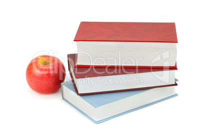 books and apple isolated on white background