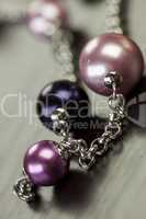Attractive shiny purple beads on jewellery