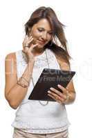 Woman chatting on a mobile while reading a tablet