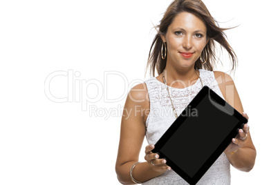 Woman chatting on a mobile while reading a tablet