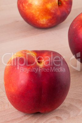 Three tasty fresh ripe juicy nectarines