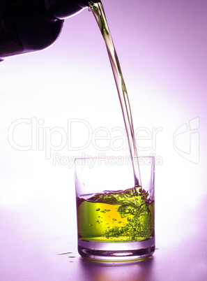 Pouring colorful drink