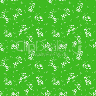 Seamless pattern with white rabbits over green