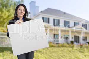 Hispanic Female Holding Blank Sign In Front of House