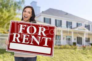 Ethnic Female Holding For Rent Sign In Front of House