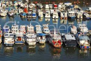 Various parked boats in row