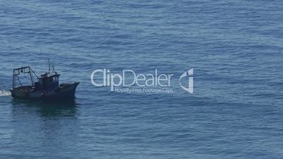 Fishing Boat Floating on the Ocean Waves, closeup