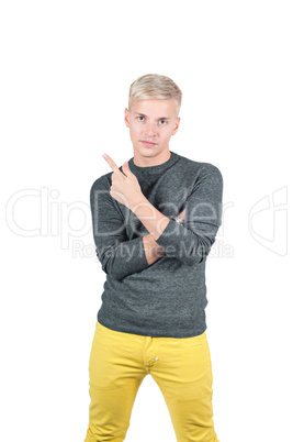 Young handsome guy showing somewhere with finger