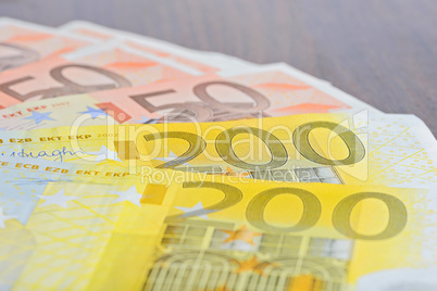 Close-up of 200 and 50 Euro banknotes on the table