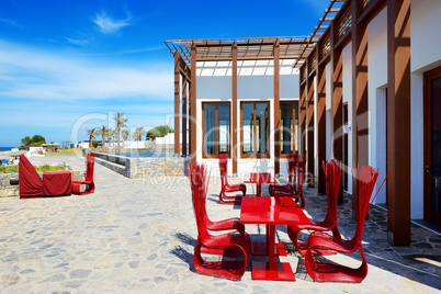 The outdoor restaurant near beach at luxury hotel, Crete, Greece