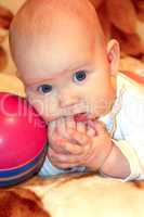 little baby playing with ball