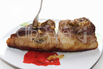 baked piece of meat on the plate