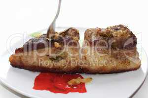 baked piece of meat on the plate