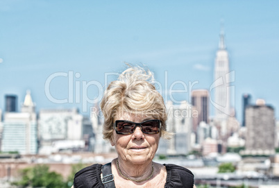 Caucasian tourist female in 60s visiting New York City on a sunn