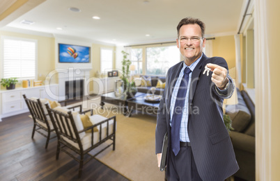 Male Real Estate Agent Holding Keys in Beautiful Living Room