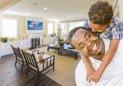 Afrian American Father and Mixed Race Son in Living Room