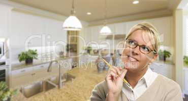 Daydreaming Woman with Pencil Inside Beautiful Kitchen