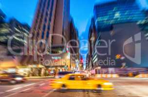 Blurred picture of Yellow Cab speeding up in the night, New York