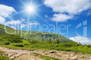 scenic mountains, blue sky and sun