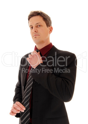 Businessman fixing his tie.