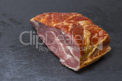 smoked pork chop on a slate plate