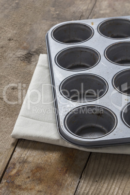 Muffin tray on wooden table