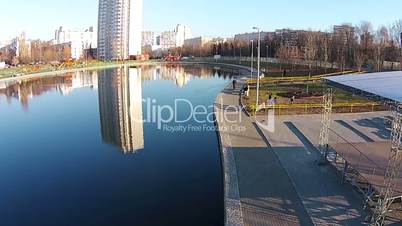 Flight over the city pond in autumn