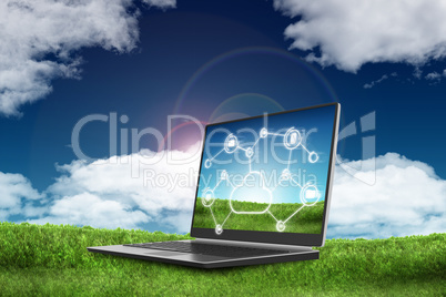 Laptop on green grass