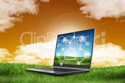 Laptop on green grass