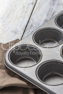 Muffin tray on wooden table