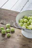Brussels sprouts in a sieve on a table