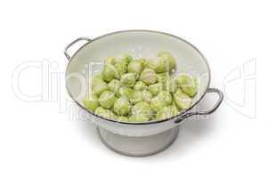 Brussels sprouts in a sieve