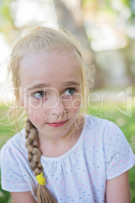 Beautiful little girl with big eyes outdoors