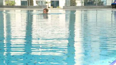 Woman Swimming in a pool