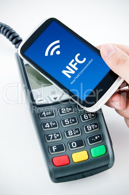 Contactless payment card with NFC chip in smart phone