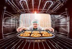 Chef cooking in the oven.