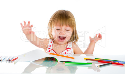 Little baby girl draws pencil